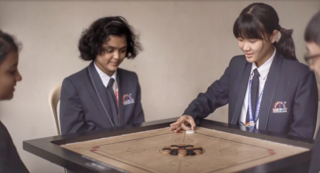 Students playing carrom